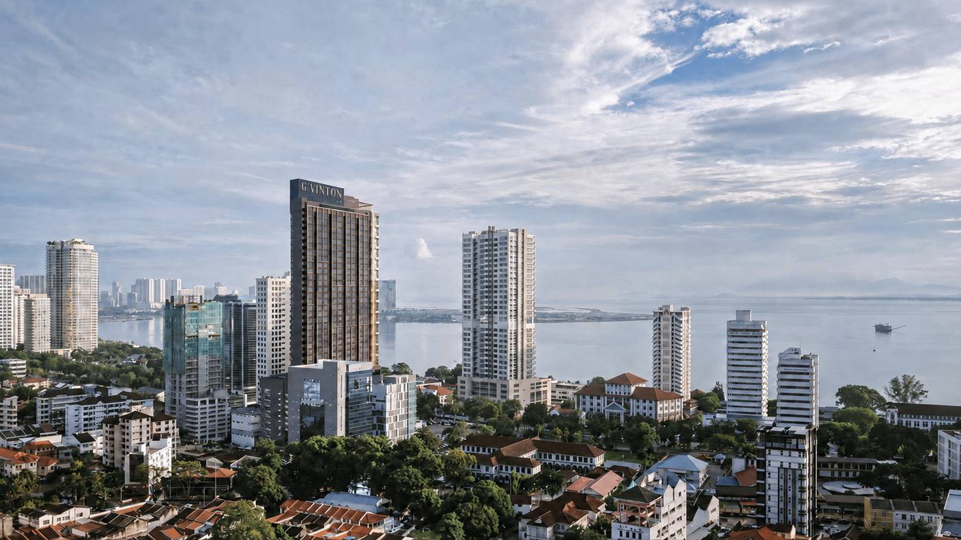 G'Vinton tower against Penang's coastal skyline